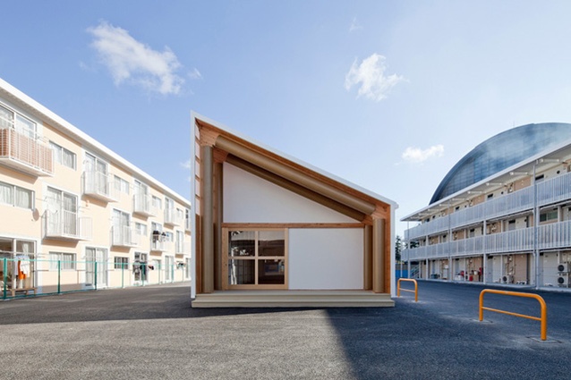 Atelier made with paper tubes and container shipping facades as part of Shigeru Ban Architects' temporary container housing project in Onagawa, Japan
