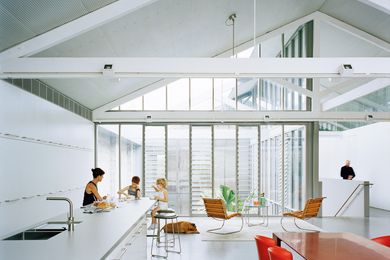 Louvres around the courtyard's glass walls allow for privacy and help to create internal vistas between rooms.