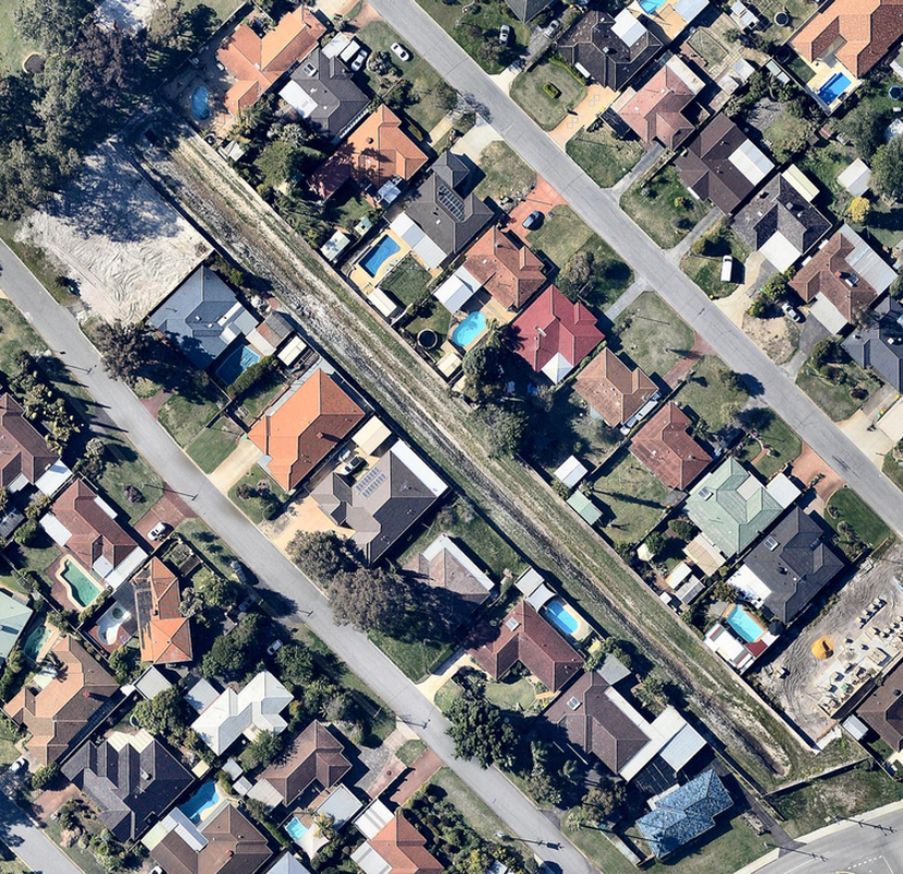 An aerial view of houses backing onto a 90-metre long open drain in Perth.  