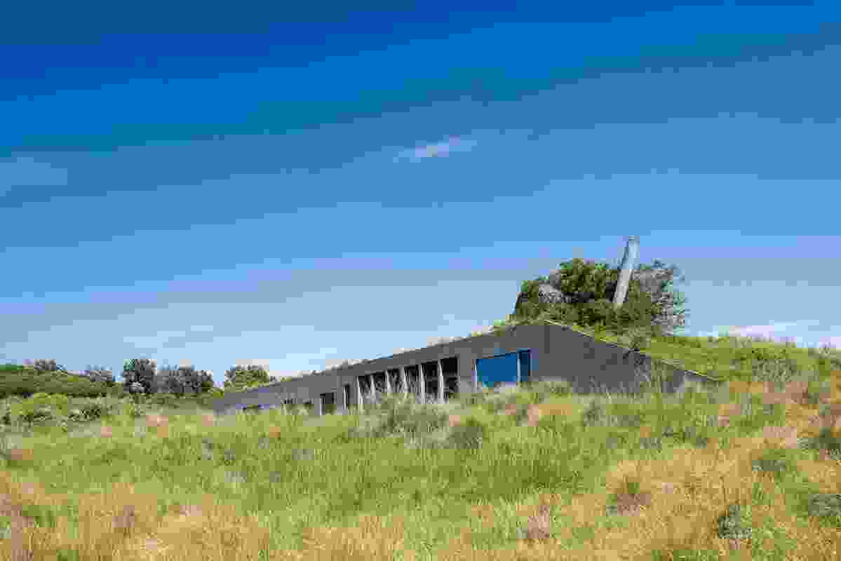 The Phillip Island House (1992) is a concrete box that is completely hidden from the landward side.