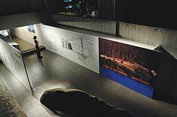 Looking into the lower-level gallery space from above. Image and detailed drawings are of the Boyd Art Centre.