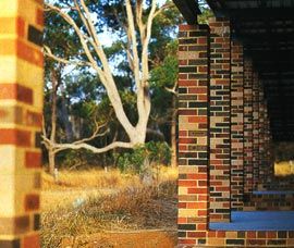 The brick colonnade, on the north side, was borrowed from a nearby sports centre. Image: Robert Frith