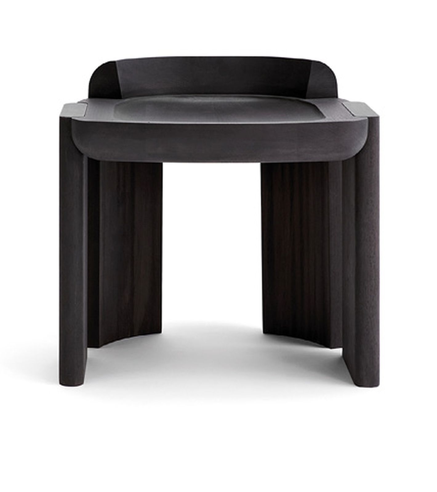 The Nevers stool in ebonized walnut wood has the same robust shapes as Cameron’s “Nevers” architecture photography.