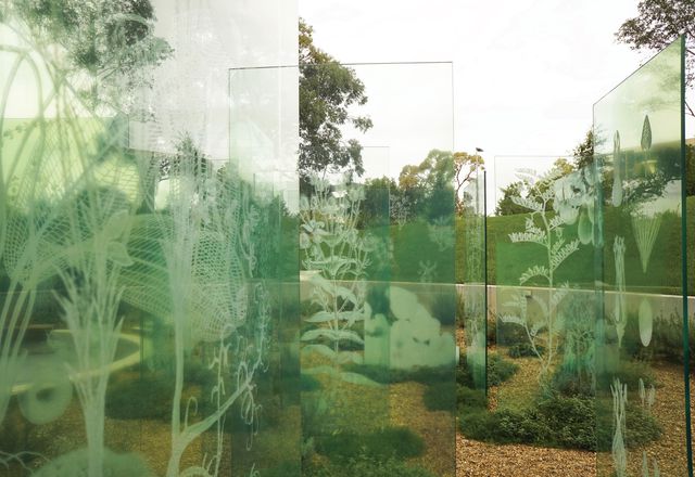 A formal grid of glass panels acts as both veils and screens in the garden, presenting and preserving memories.