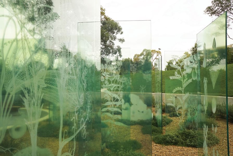 A formal grid of glass panels acts as both veils and screens in the garden, presenting and preserving memories.