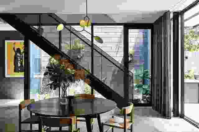 Steel elements and lush garden create a mood that is equal parts industrial and botanical. Artwork: Helen Gory.