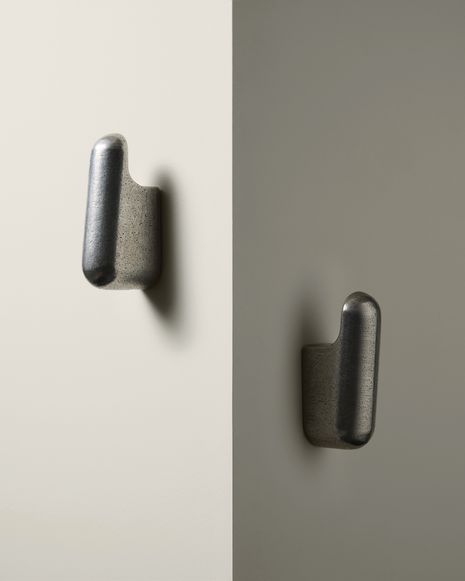 The Cusp wall hooks, shown in cast aluminium, explore the beauty of utility.