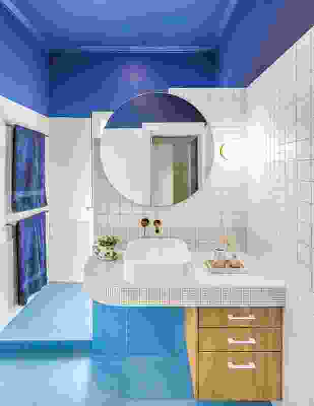 Various shades of blue, including on the terrazzo floor, bring playfulness to the ensuite.