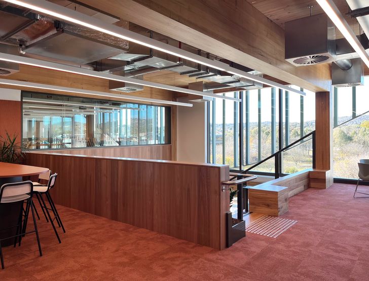 Each floor of the five-level building is distinguished by colour, with muted earth tones at ground level and lighter sky tones above encouraging clear wayfinding.