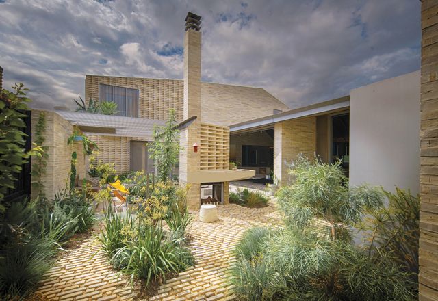 A central courtyard helps “divide” the house, with Mediterranean plants referencing the previous owner Maria’s garden and indigenous plants broaching a reconnection with Country.