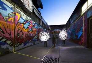 Children draw with light at Glow: Monarch Lane.