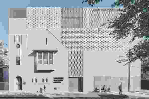 The hit-and-miss masonry facade resonates with the warp and weft of tapestries by Jewish Bauhaus artist Anni Albers.