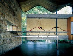 The floating concrete panel, with dining table in front. 