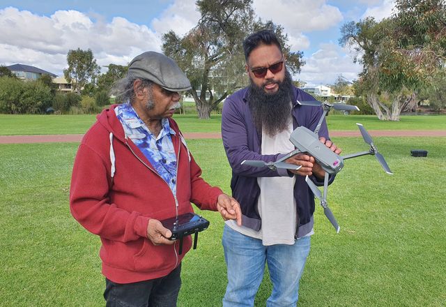 Ballardong Whadjuk Elder Uncle Kelvin Garlett learns about drone-flying with Wiru Drone Solutions.