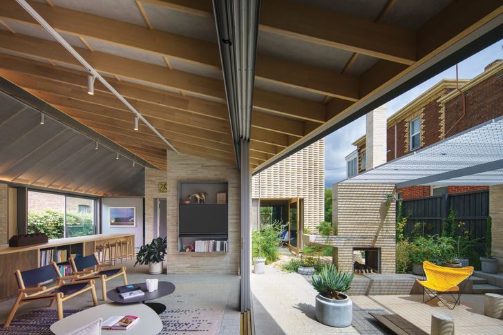 The main living space is protected by expansive eaves and opens to a northern courtyard with a fire pit.