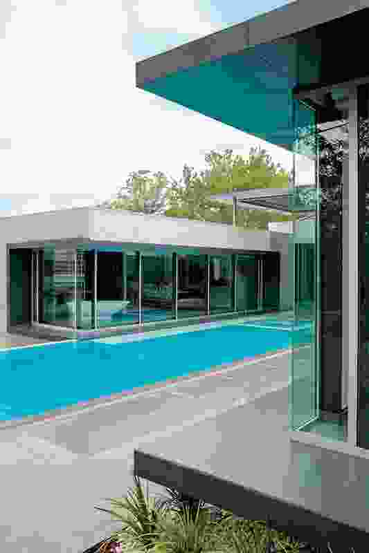 Three new pavilions surround a courtyard; a garage is under the pool.