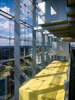 View from one of the main internal circulation balconies. The formal character of the building carries through into the interior spaces.