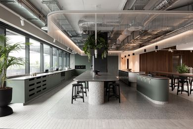Flooring in Fibonacci Brackish terrazzo helps to define a large kitchen zone in the fit-out.
