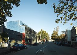 View west along Kerr Street. The top floor of the building has been set back to reduce its scale on the street. Image: Peter Bennetts.