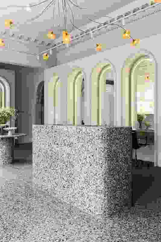 For its durability and aesthetic qualities, terrazzo was used for the flooring and fixed furniture.