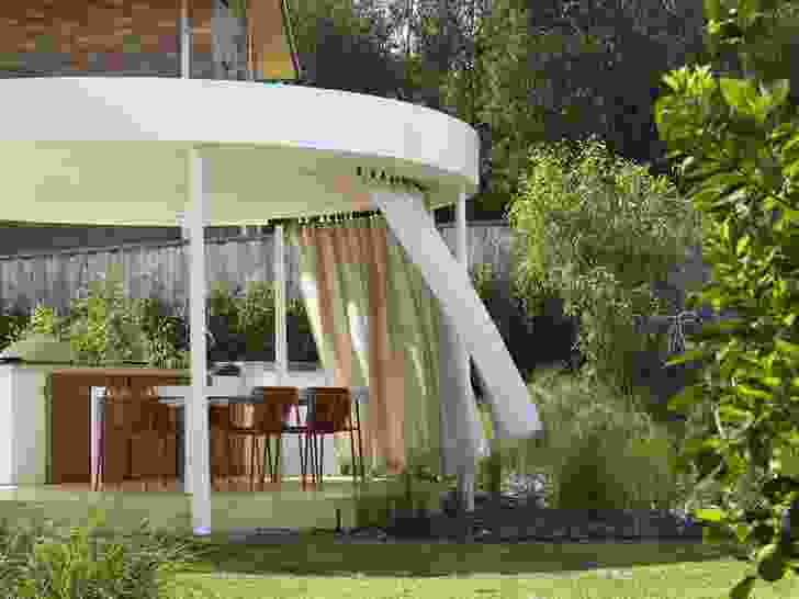 The curtain animates the rotunda and can be easily adjusted to manage privacy and sun.