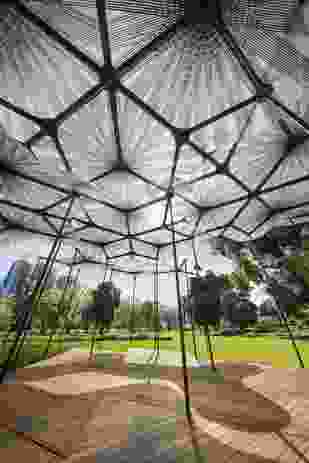 The 2015 MPavilion designed by Amanda Levete creates a pattern of shadows on the ground.