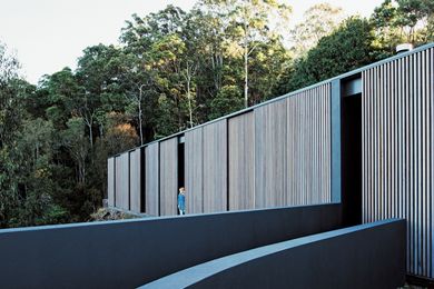Sliding timber screens, reminiscent of Japanese tea houses, provide for the control of light, privacy and outlook.
