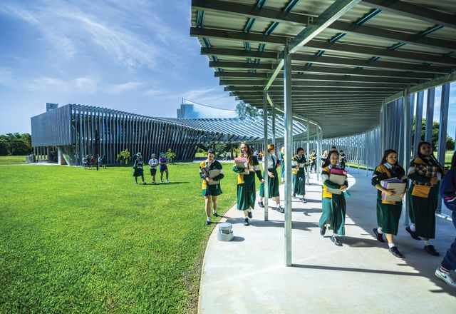 The new science building at Trinity Anglican School is a concrete and single masonry block structure wrapped in a sunscreen of prefabricated steel channels.