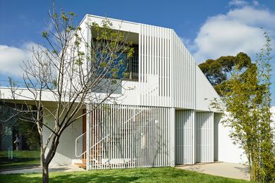 A new garden pavilion provides a guestroom, music room, laundry, garage and extra storage, while also creating a visually appealing backdrop to the backyard.