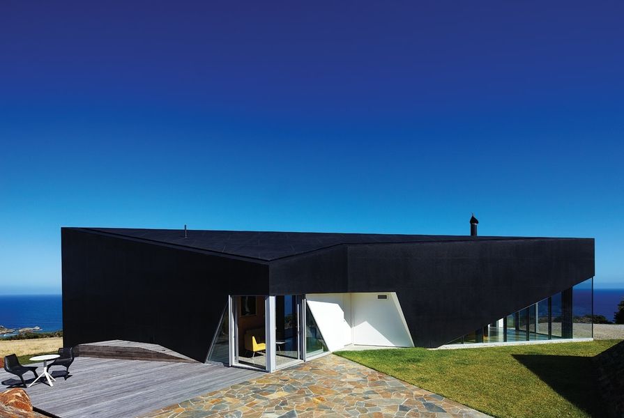 As a black object in the landscape, the house has gravitas beyond its size.