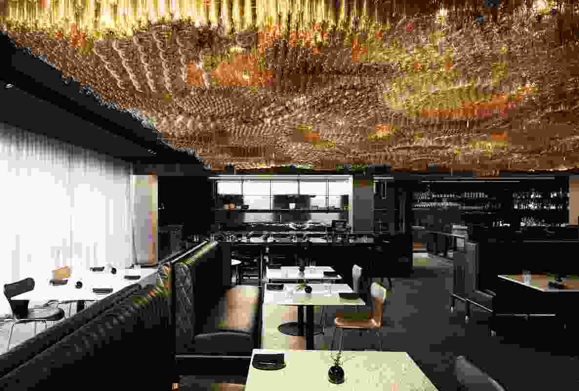 The restaurant, playfully named Doot Doot Doot, features a “bubbling golden ceiling” made from 10,000 Edison globes.