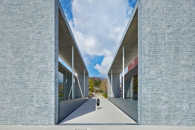 Facet Studio won the Doshisha University Chapel Complex design competition with a design that splits the program of chapel and exhibition space into two volumes.