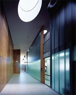 The corridor on the south side of the building that separates the plywood-clad microscope rooms and the research offices.