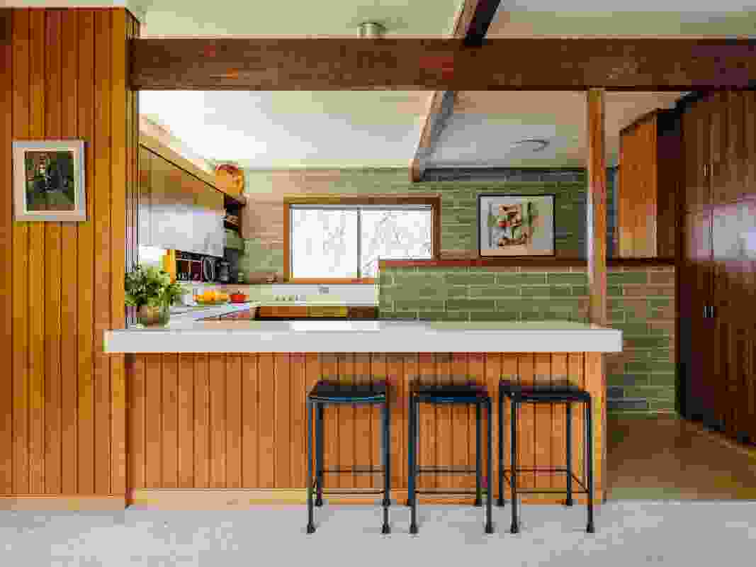 The kitchen was at the centre of the home, and Bill Shugg’s children recall many evenings spent with friends gathered around its bar. Artworks (L–R): Parker, Marion Shugg.