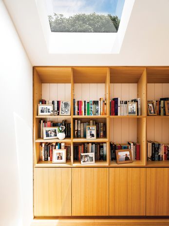 A screen of vertical battens gives a sense of warmth to the upstairs bedroom.