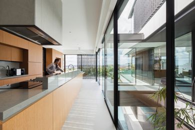 The main living area is punctuated and zoned by a light well to the internal courtyard garden below.