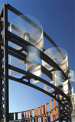 Wind turbines on an old oil tank generate power for the site. Image: Christian Borchert