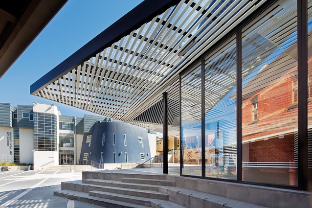 The annexe sits in a back-of-house context, facing an underused plaza.