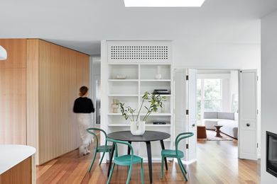 A dividing wall was removed to open the kitchen and sitting room into a single, central space.