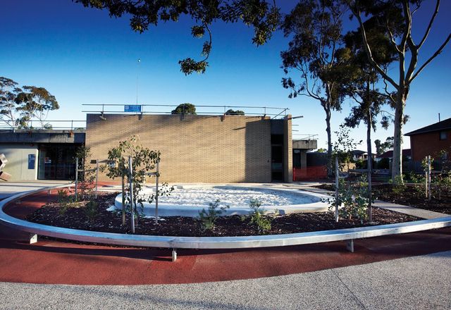 Young gum trees surround a circular sandpit in Preston Library’s forecourt.