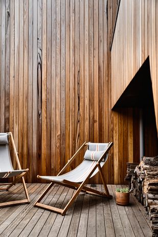 The courtyard of Sandy Point House by Kennedy Nolan is sheltered from prevailing winds.