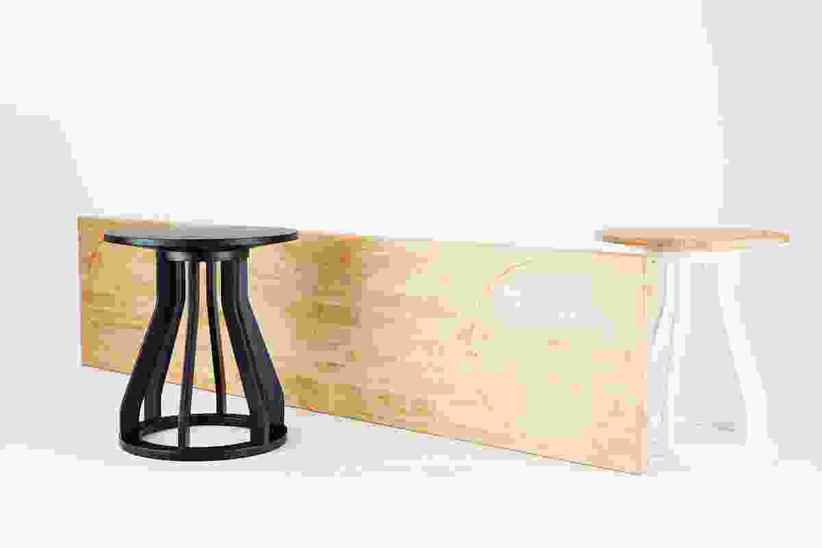 Jon Goulder Plank Bench with black and white Spool Stools.