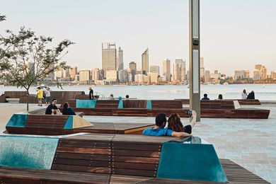 Sleek timber benches and brightly coloured picnic tables provide resting places and offer views of the city skyline to the north and south.