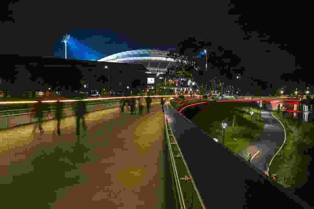 Walking across Riverbank Bridge towards Adelaide Oval, showing the new bicycle path and river-edge treatment at the lower level. 