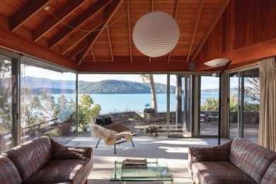 Taking pride of place in this adult’s retreat, the living room opens to the northerly waterfront terrace through floor-to-ceiling glass.