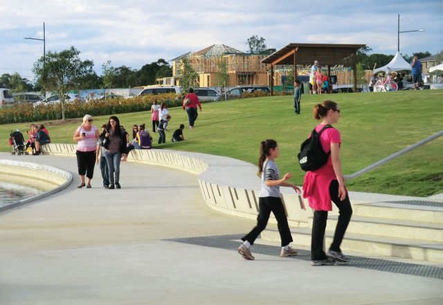Robust seating walls, lawn embankments and park facilities have created a popular new waterfront.