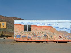 Mural painted by residents of the Larapinta Valley Town Camp community on the side of the Larapinta Valley Learning Centre.  Photograph Larissa Johnson.