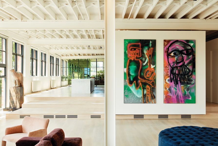 Oliver’s renovation of an expansive warehouse apartment creates a space where art and everyday living are intertwined. Artwork (L-R): Bruce Armstrong, Sidney Nolan.