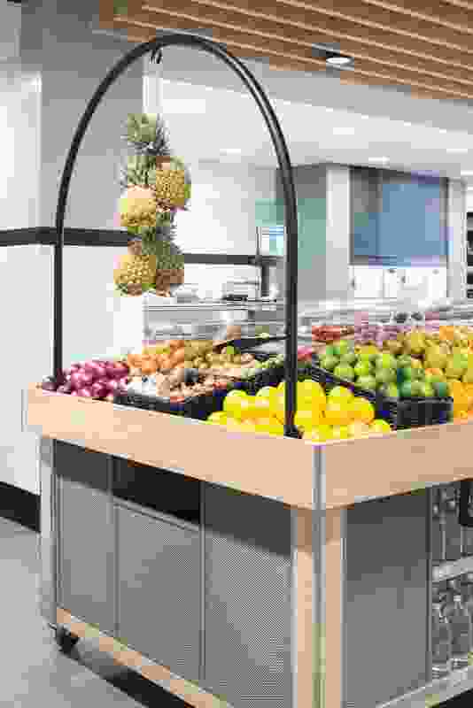 The store has a light palette, making fresh produce stand out.