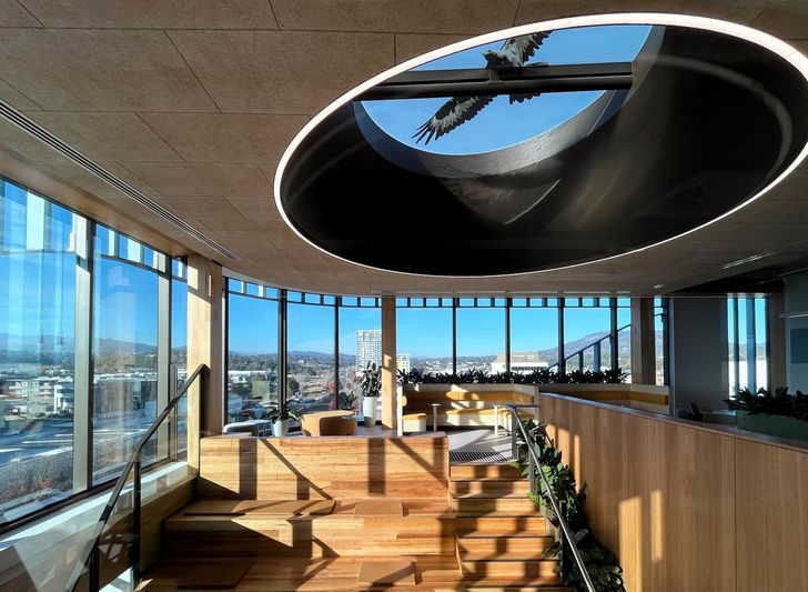 At roof level, a circular oculus featuring a wedge-tailed eagle is intended to represent a totem of the Ngunnawal people.